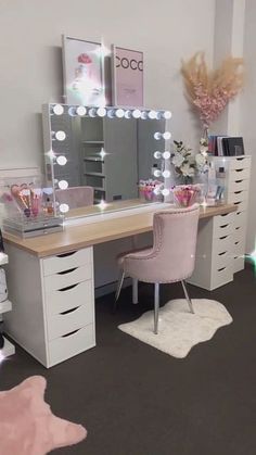 a room with a desk, chair and mirror in it that has lights on the table