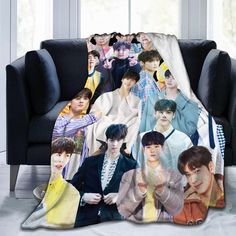 a blanket with the image of bts on it is sitting in front of a couch