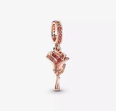 "This Rose Gold Flower Dangle Charm is hand-finished in rose gold plating finished, engraved with the words \"I'm yours\" this flower-shaped dangle charm is detailed with pink cubic zirconia stones & is inspired by William Shakespeare's famous play Romeo & Juliet. Express your feelings to your sweetheart with this statement charm. Compatible with Pandora. Gift: Please select gift at checkout. All charms come with a self assemble pillow box, tissue paper & ribbon. Gift wrap is supplied for as lit Romeo Und Julia, Pandora Rose, Charms Pandora, Bracelet Pandora, Pandora Bracelet Charms, Pandora Silver, Rose Gold Pink, Bracelet Diy, Leather Bracelets