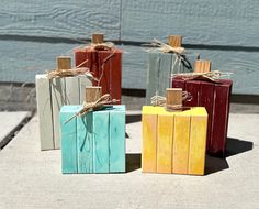 four small wooden blocks tied with twine