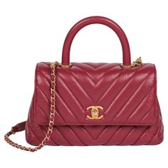 Chanel Red Chevron Aged Calfskin Leather Small Coco Top Handle Xupes Reference: HB5169 Serial Number: 26814854 Age (Circa): 2018 Accompanied By: Chanel Dust Bag, Authenticity Card Authenticity Details: Authenticity Card, Serial Sticker (Made in Italy) Gender: Ladies Type: Top Handle, Shoulder Colour: Red Hardware: Antiqued Gold Material(s): Aged Calfskin Leather Interior: Red Textile Closure: Turn Lock Height: 14cm Width: 23cm Depth: 9cm Handle Drop: 7cm Additional Strap Drop: 42cm Excellent Pre-Owned Condition -The exterior is in excellent condition with light signs of use. -The interior is in excellent condition with light signs of use. -The hardware is in excellent condition with light signs of use. -The corners are in excellent condition with light signs of use. -Overall this item is i Chanel C19, Red Textiles, Leather Trunk, Chanel Jumbo, Louis Vuitton Brown, Handbags Online, Handbag Backpack, Fashion Handbags, Chanel Bag