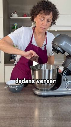 a woman in an apron using a mixer on a kitchen counter with the words dedans verser above it