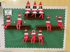 the elfs are hanging on the shelf in the classroom