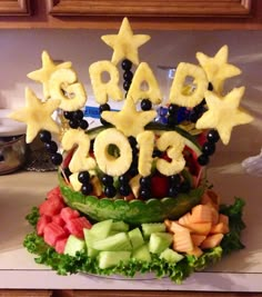 an arrangement of fruits and vegetables arranged in the shape of stars on top of each other