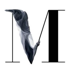 the letter m is made up of black and white paper with an abstract design on it