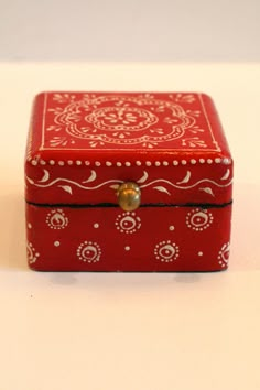 a red and white box sitting on top of a table