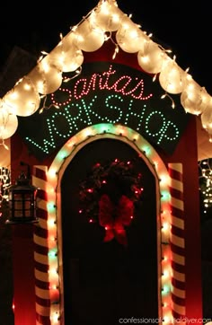 a lit up entrance to a house with christmas lights on it