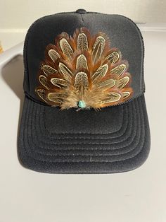 Beautiful pheasant feathered trucker hat in  BLACK.  Handmade embellishment on a 5 Panel, foam front Trucker Hat. Country Concerts Western Attire Rodeos Girls night out Boho cowgirl indie Stagecoach Outfit summer hat Beach hat Western Black Costume Hats For Festivals, Black Western Costume Hats For Festivals, Western Black Hat With Feathers, Black Trucker Hat For Festivals, Black Western Hat With Feathers, Western Style Trucker Hat With Short Brim For Festivals, Southwestern Black Hat With Short Brim, Bohemian Black Hat Band For Western-themed Events, Bohemian Black Hat For Western-themed Events