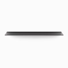 a black shelf sitting on top of a white wall