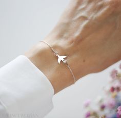 Introducing our elegant Minimalist Swallow Bracelet, crafted from high-quality 925 sterling silver. This delicate bracelet features a charming swallow symbol, making it a perfect piece of symbolic jewelry. The swallow is a powerful symbol of hope, freedom, and love, making this bracelet a beautiful gift for birthdays, divorces, new beginnings, or travel. Ideal as a gift for her, whether for a wedding, birthday, or any special occasion, this bracelet is a timeless addition to any jewelry collecti Bird Bracelet, Freedom Travel, Symbols Of Freedom, Gift Girlfriend, Symbolic Jewelry, Hope Symbol, Gift For Her Birthday, Girlfriend Gift, Travel Lover