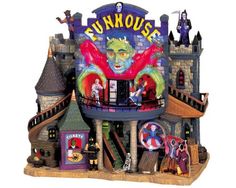 a toy house with an evil clown on the top and other toys around it's perimeter