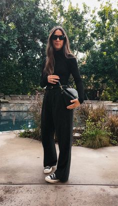 Black Split Leg Pants Outfit, Women’s Overalls Outfit Black, Split Hem Trousers Outfit, Wool Wide Leg Pants Outfit, Black Slacks Casual Outfit, All Black Trousers Outfit, Business Casual Outfits All Black, Black Hoka Shoes Outfit, Wide Leg Black Sweatpants Outfit