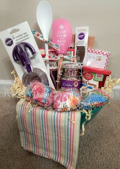 a basket filled with lots of items on top of a carpeted floor next to a wall