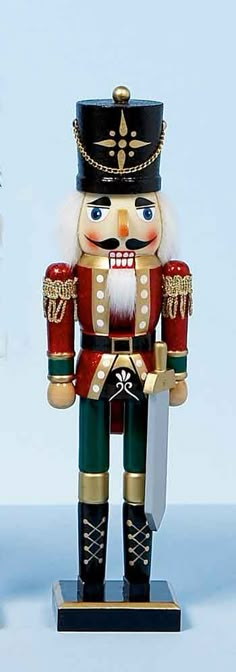 a nutcracker is standing in front of a blue background