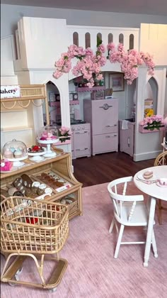 a doll house with furniture and accessories in the living room, including a dining table