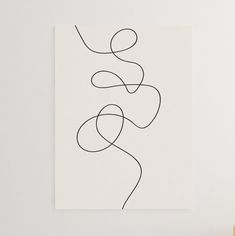 a white wall with a black line drawing on it