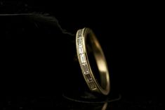 a wedding ring is shown in the dark