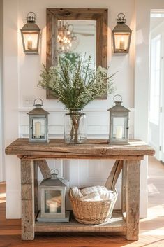 a wooden table topped with lanterns next to a mirror