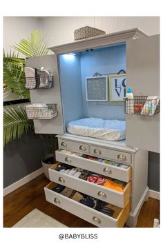 a baby changing table with drawers underneath it