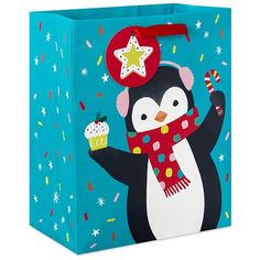 a penguin carrying a cupcake and star on it's head