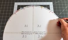 someone is cutting out the pattern for a paper pie