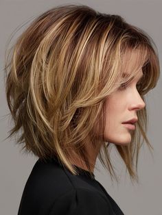 The stacked bob introduces added volume and depth at the back of the head, creating a dynamic and stylish profile. This medium-length cut is perfect for professional settings or evenings out. It particularly suits those with round faces, enhancing the facial structure with its voluminous layers. Womens Haircuts Short Layers, Long Bob Shorter In Back, Medium Length Bobs With Bangs, Layer Bob With Bangs, Haircut 2024 Trends, Rounded Bob Haircut With Bangs, Shoulder Length Bob Haircut With Bangs, Short Cut With Layers, Shoulder Length Hair Bob