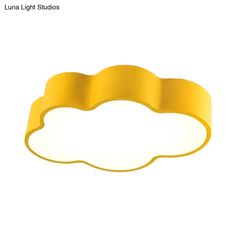 a yellow light that is on top of a white surface with the words luma light studios