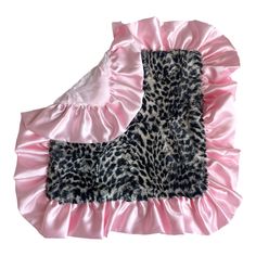 a pink and black leopard print blanket with ruffled edges