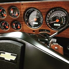 the gauges and dash board of a classic car