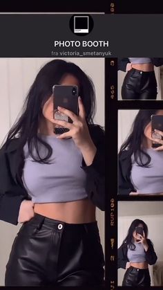 a woman taking a selfie with her cell phone while wearing leather shorts and a crop top