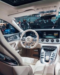 the interior of a mercedes s - class car with its steering wheel and dash lights