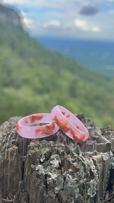 Looking for an unconventional alternative ring? This pink Cambridge style resin ring is sure to stand out in a crowd. Being so lightweight, you can wear only one or you can stack two on a finger.  Width: 6.5 mm   Handmade by me from scratch, each one of my pieces is hand pigmented, and poured into a silicone mold. After I remove it from the mold I hand sand it for you to have a smooth and comfortable piece to wear. After sanded I add more resin to the edges for a smooth and shinny look!   Please Adjustable Pink Resin Jewelry, Adjustable Pink Resin Rings, Unique Pink Open Ring, Pink Open Ring, Unique Pink Promise Ring, Handmade Pink Resin Rings, Unique Pink Promise Ring Jewelry, Adjustable Pink Stackable Promise Rings, Pink Adjustable Stackable Promise Rings