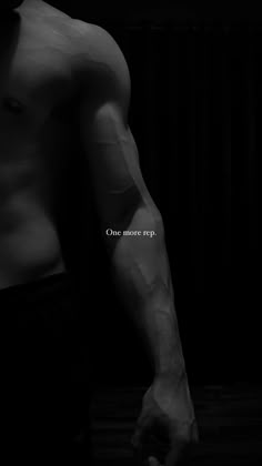 a shirtless man with no shirt standing in front of a black background and the words one more rap written on his chest