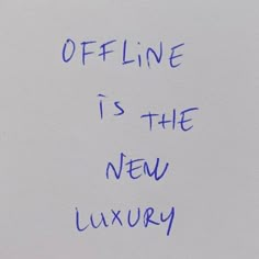 a piece of paper with writing on it that says offline is the new luxury