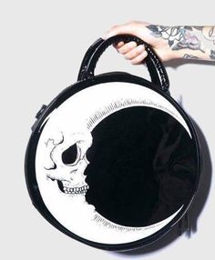 This Skull Crescent Moon Bag is spacious enough to fit all of your important belongings easily. It can also be carried in two different ways - as a cute handbag or a cool crossbody bag! Carefully assembled and made with high quality shiny enamel, this Gothic-inspired bag is a perfect accessory for everyday use. Material: Enamel, Polyester and Nylon Chain Bag Size: Diameter 28.5 x Thickness 7 cm (11.2" x 2.7") Chain Length: Approximately 100 cm (39.3") Click ADD TO CART To Order Yours Now! The Checkout Process is Guaranteed to be 100% Safe and Secure with Visa, Mastercard, AMex, Discover, Apple Pay or PayPal. Sewing Handbags, Round Handbag, Satin Purses, Skull Bags, Gothic Bag, Girl Punk, Round Purse, Fashion Around The World, Gothic Crosses