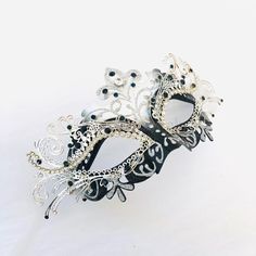 Masquerade mask in silver/black or Gold/Black base studded with rhinestone embellishing. S H I P P I N G - Processed same day or within 24 hours. 1-2 day guaranteed delivery services offered, add items to cart and click on shipping tab for rates. Pls leave a check out note with your need date & contact number (especially for expedited and custom orders) Msg for delivery time frames (Include your state/country). I N C L U D E D Mask comes with matching ribbons S I Z E Adult Size Mask. Detaile Elegant Black Masks For Carnival, Elegant Black Eye Mask, Silver Rhinestone Eye Mask For Masquerade, Silver Rhinestone Eye Masquerade Mask, Elegant Silver Masks For Halloween, Elegant Black Masquerade Mask For Mardi Gras, Elegant Black Eye Mask For Masquerade, Elegant Black Masks And Prosthetics For Evening, Elegant Silver Eye Mask