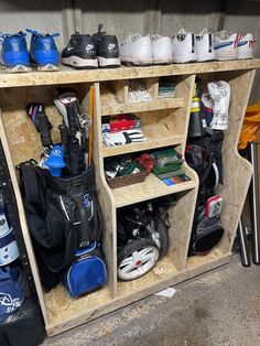 several wooden shelves filled with different types of sports equipment