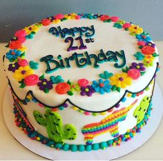 a birthday cake decorated with colorful flowers and the words happy 21st birthday written on it