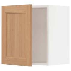 an open cabinet door on the side of a white wall with wood grained doors