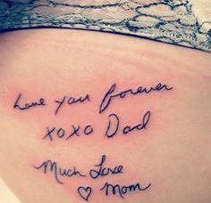 the back of a woman's stomach that says, top 15 mom dad tattoo designs