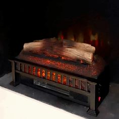 a fire burning in a fireplace with logs on the top and flames coming from it