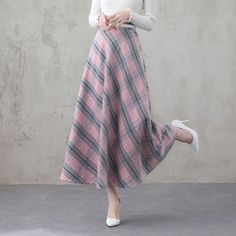 "This winter wool skirt is a classic piece of tailoring that will see you through rain or shine. It is cut with a flattering flared skirt to give you a wonderful shape. The winter skirt is perfect classic styling and ends at the ankle. This is a versatile skirt that you'll wear again and again. DETAILS: * 30% wool, 30% fiber, 40% polyester * fully satiny liner * Two side pockets * Right zip closure * Back elastic, comfortable wear * Plus size full skirt * Ankle length skirt * Perfect for Winter, Pink Midi Skirt For Fall, Pink Fall Midi Skirt, Long Pink Skirt For Fall, Pink Long Skirt For Fall, Spring Wool Midi Skirt, Spring Long Wool Skirt, Spring A-line Wool Skirt, Wool Long Skirt For Spring, Long Wool Skirt For Spring