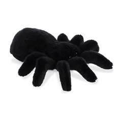 black spider plush toy on white background