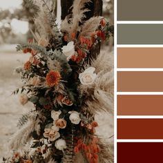 an arrangement of flowers and foliage in shades of brown