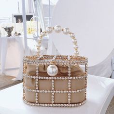 Luxe Rhinestone Cage With Pearl Handle Mini Bag. Amazingly glamorous and beautiful rhinestone cage basket bag with pearl beads handle. Looking like cinderella's crystal carriage, this is certainly for a special events and instant head turner. Bring it to gorgeous parties, weddings and just to be fashionable. 2 Styles - 1-Pouch & 2-Velvety Flannelette Lining Size: L19cm x H12cm x D9cm Item Type: HandbagsGender: WomenHardness: HardDecoration: PearlHandbags Type: TotesMain Material: Metal, Rhinesto Pearl Decorations, Diamond Decorations, Summer Handbags, Crystal Clutch, Clutches For Women, Party Purse, Velvet Interiors, Luxury Diamonds, Evening Handbag