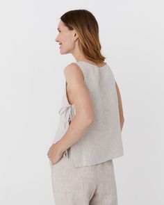 Enjoy effortless style with the LUCERNE linen top in natural melange. This breezy piece features side ties that create a chic cut-out effect, complementing its sleeveless design and round neckline for a comfortable fit. Perfect for warm weather, this top offers a flattering and versatile addition to any wardrobe. • Straight cut • Round neckline • Sleeveless Lucerne, Linen Top, Straight Cut, Warm Weather, Effortless Style, Round Neckline, Cut Out, Round Neck, Comfort Fit