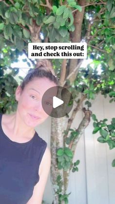 a woman standing in front of a tree with the caption hey, stop scrolling and check this out