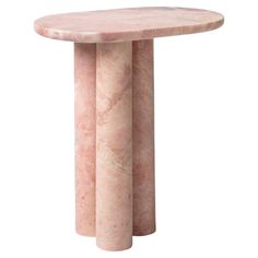 a pink marble table with three columns in the shape of an oval, on a white background