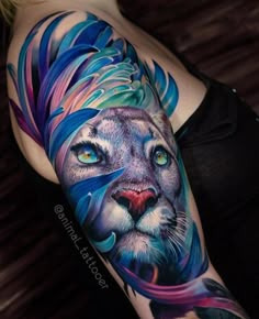 a woman's arm with a colorful lion tattoo on the left side of her body