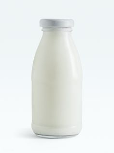 a bottle of milk is shown on a white background with the lid down and no label